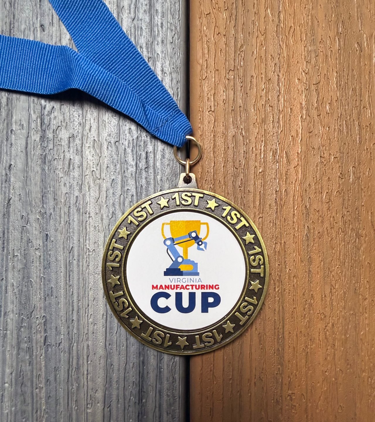 A picture of a medal for the "Coolest Thing Made in Virginia" that Trex won for composite decking.